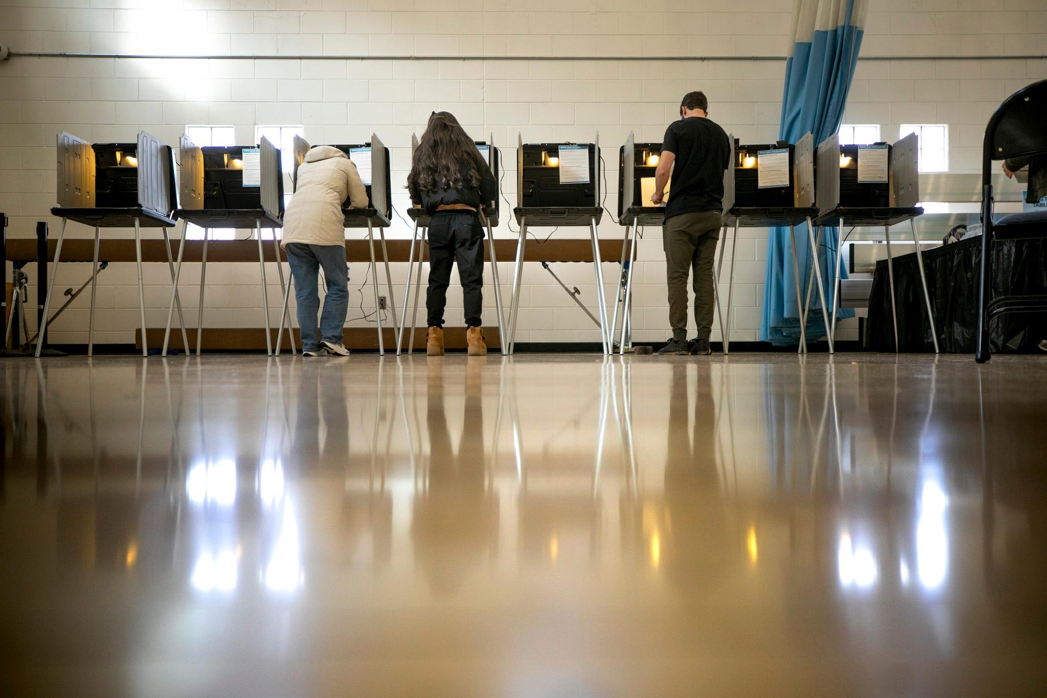 People vote at Denver Elections' polling station