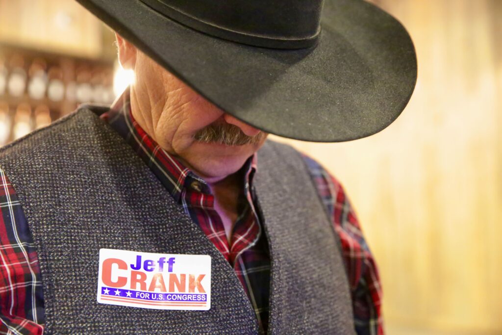 A Jeff Crank supporter watching as election results come in