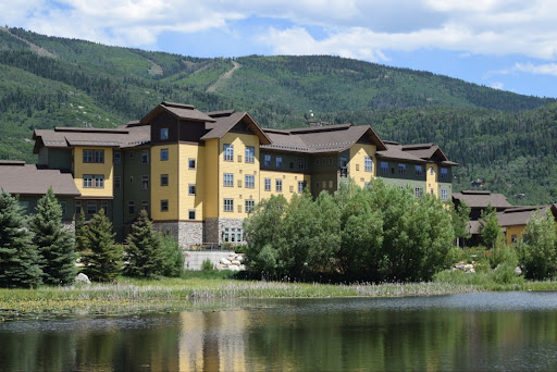 Photo shows Casey's Pond Senior Living complex in Steamboat Springs by a pond.