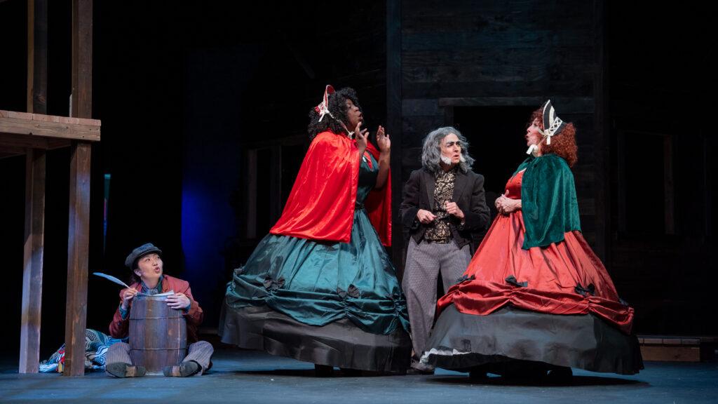 A lively scene with period costumes on stage at the Aurora Fox comedy Christmas show.