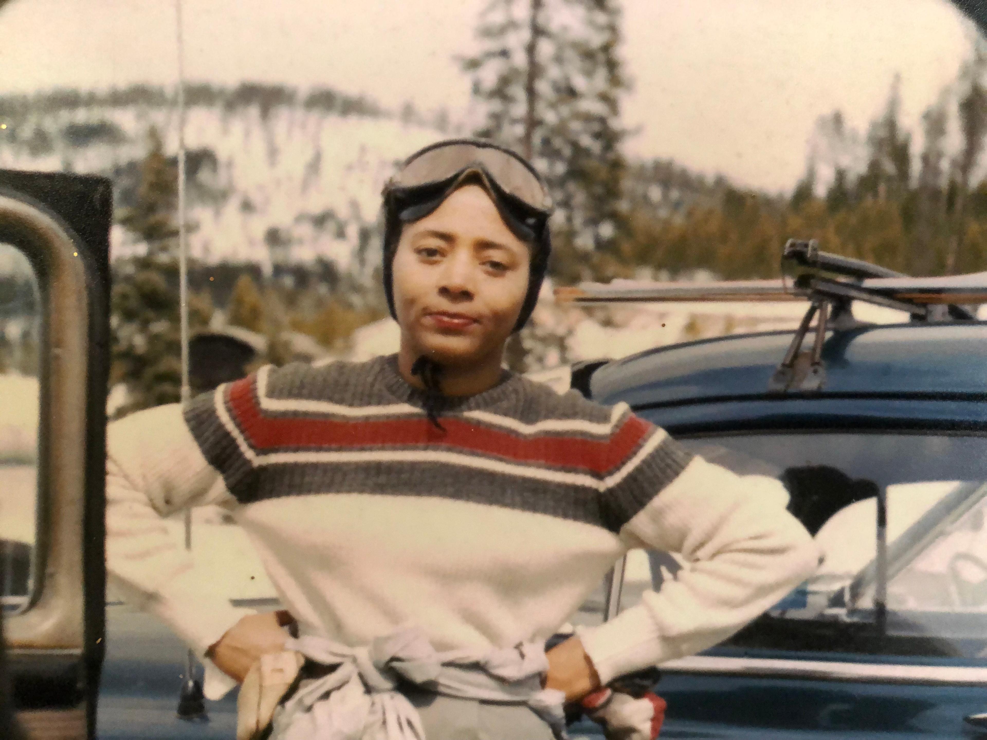 Val Tanaka pictured in ski clothes in front of a mountain