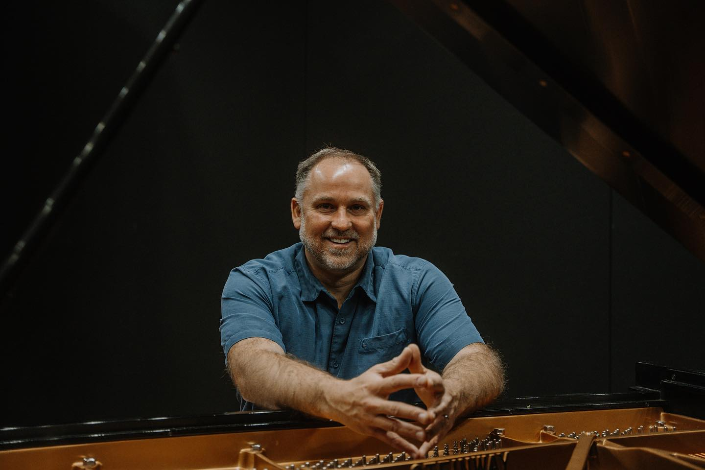 Host Matt Weesner at the piano, looking directly at the camera.