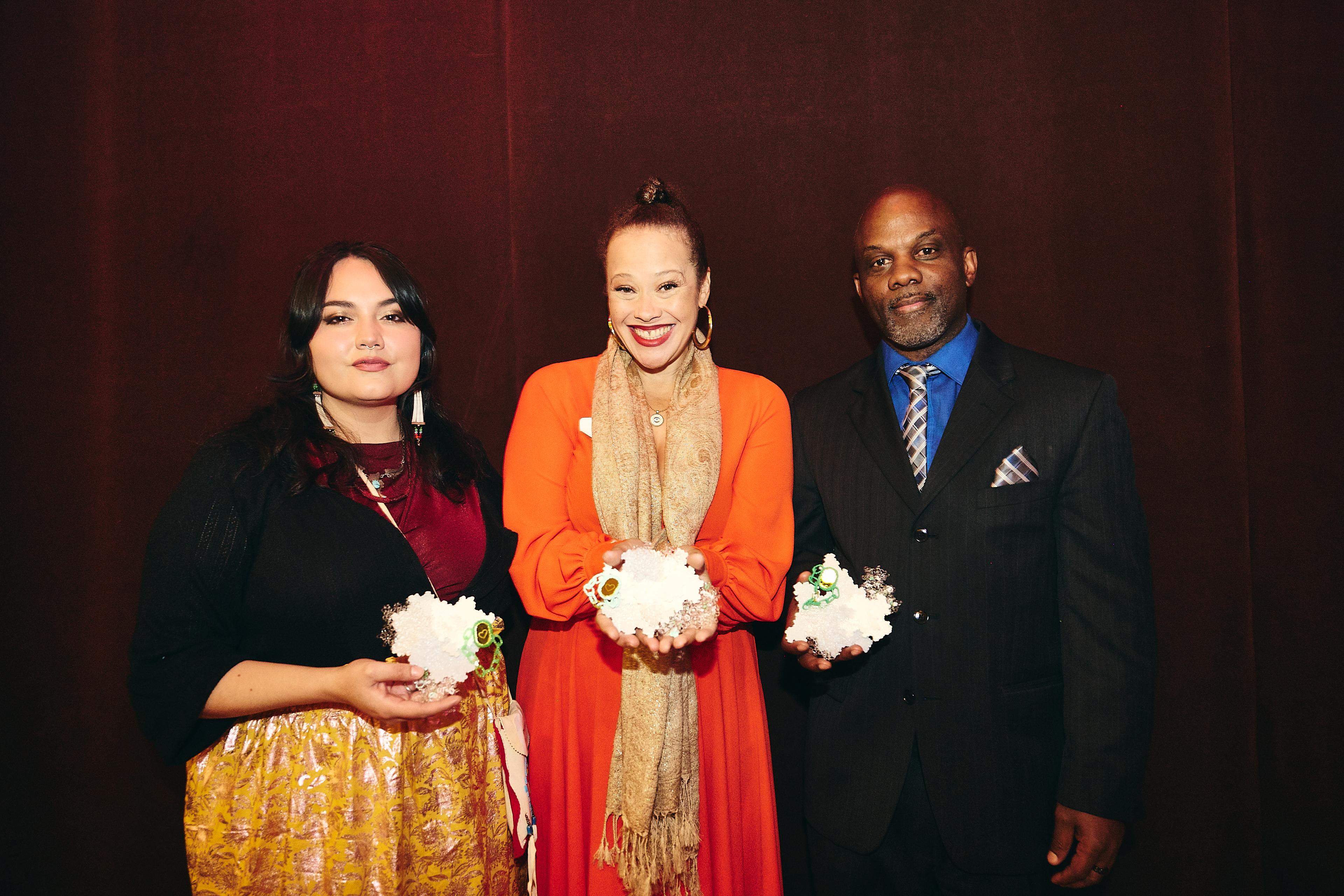 Artists Chelsea Kaiah, Suzi Q. Smith and Jeff Campbell hold their Social Impact Awards at the ceremony on Nov. 19, 2024