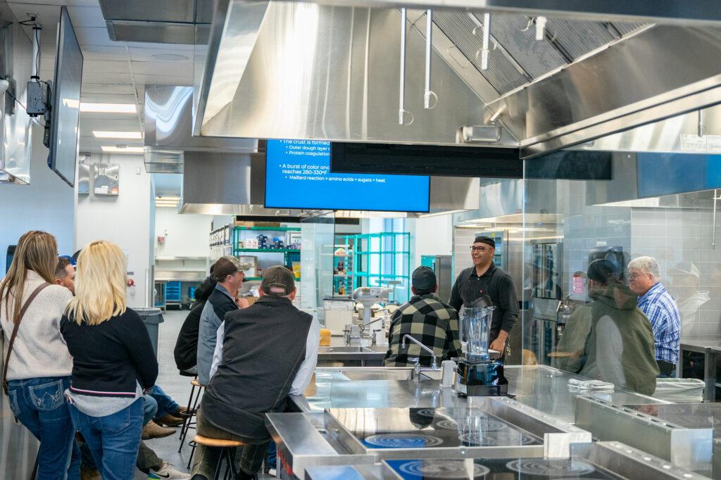 A food scientist speaks to visitors at Colorado State University's Food Innovation Center