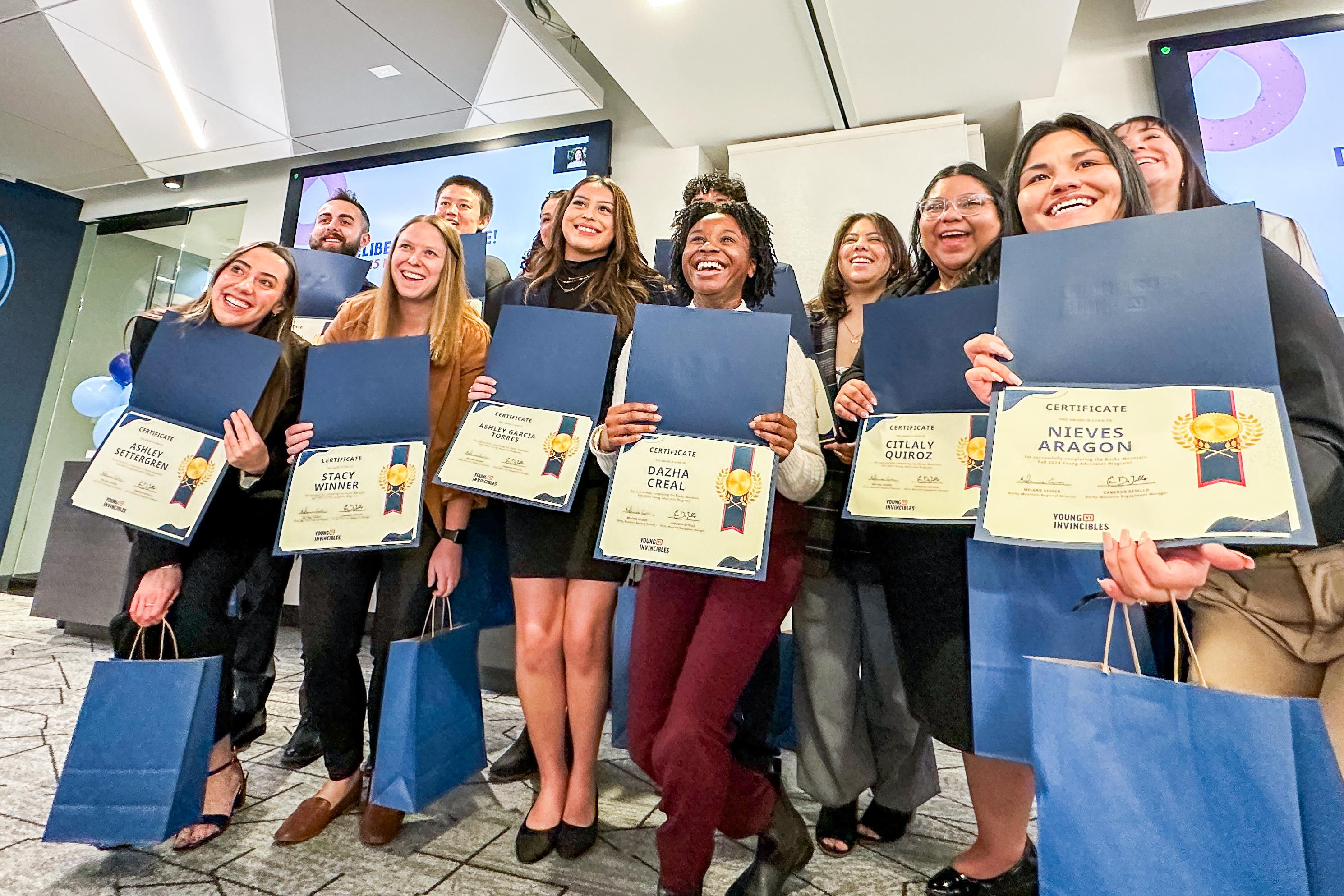 Youth participants pose with their certificates of completion at the end of the Young Invincibles' inaugural Policy Shark Tank