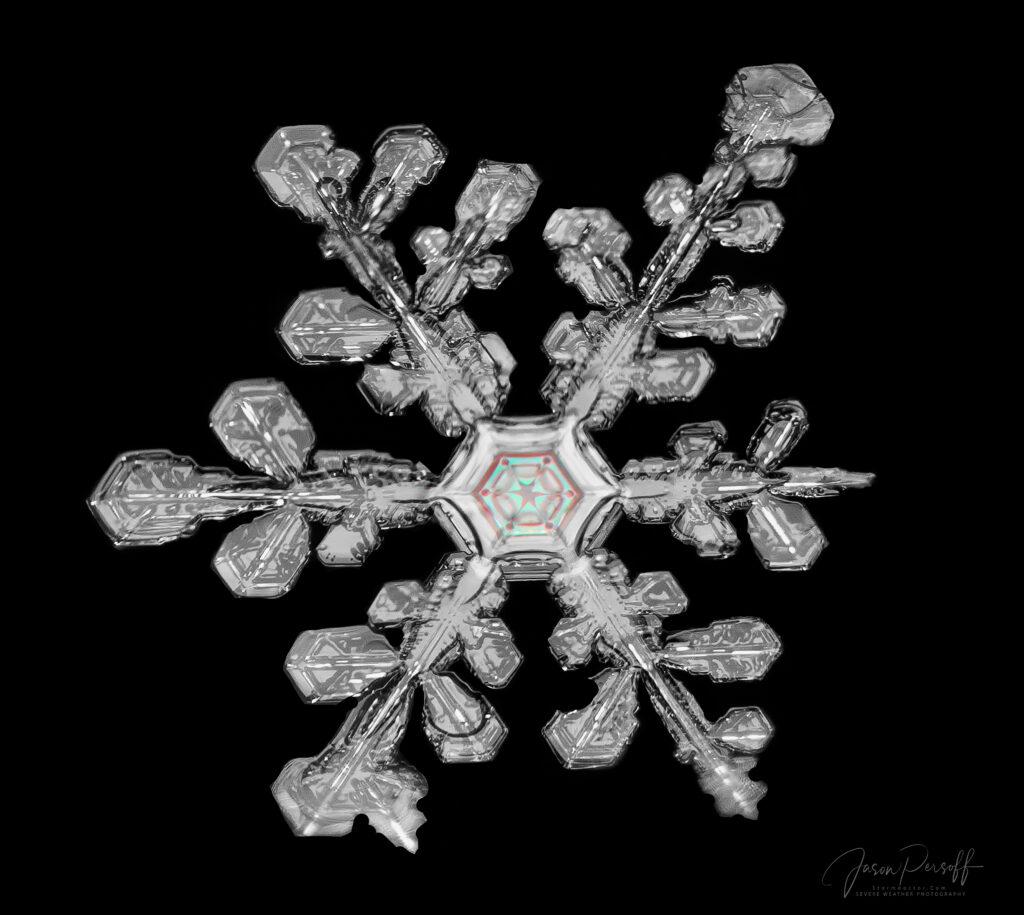 A snowflake with six outcropings and a perfect hexagon in the middle.