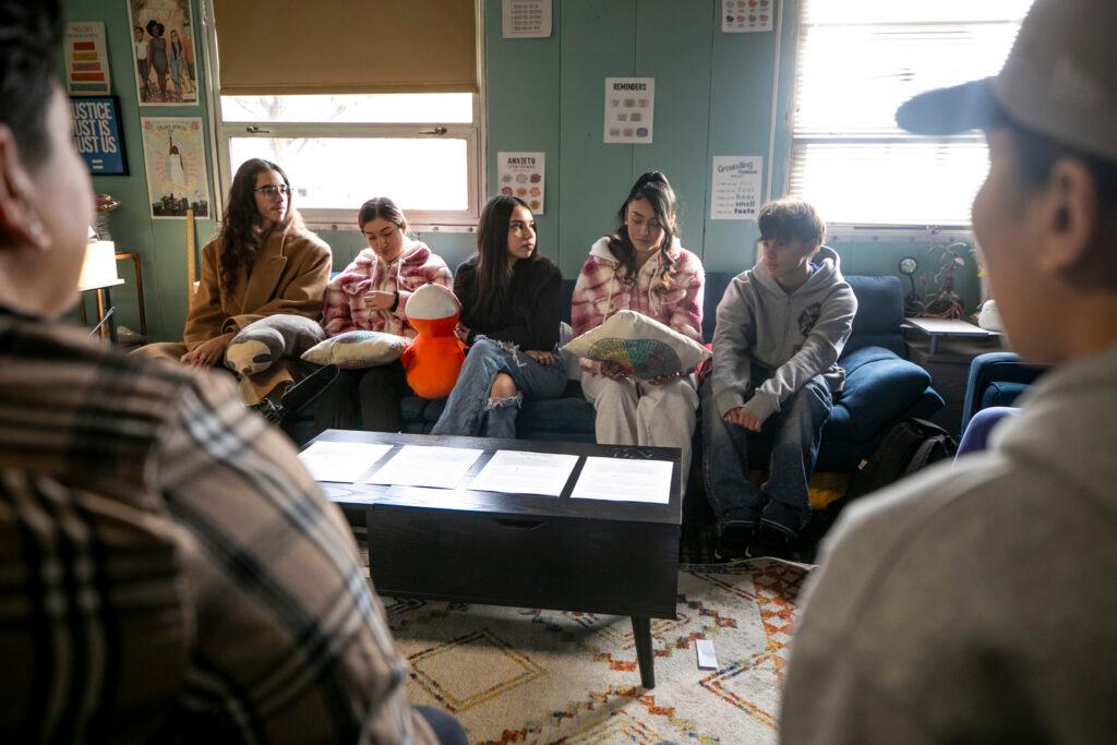 A student speaks in a group.