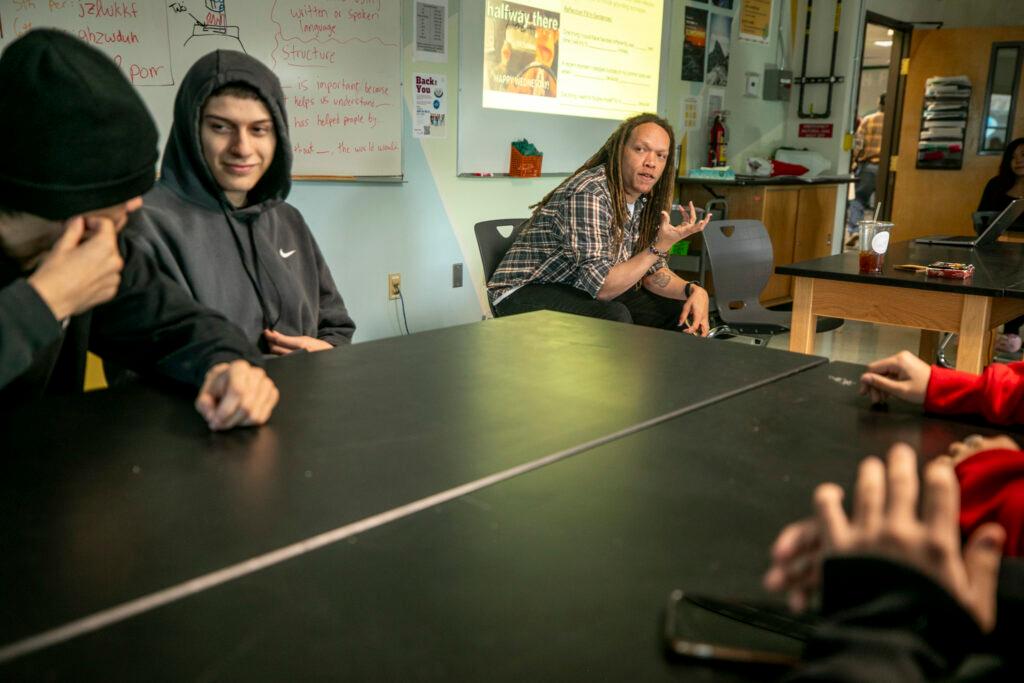 A teacher talks to students.