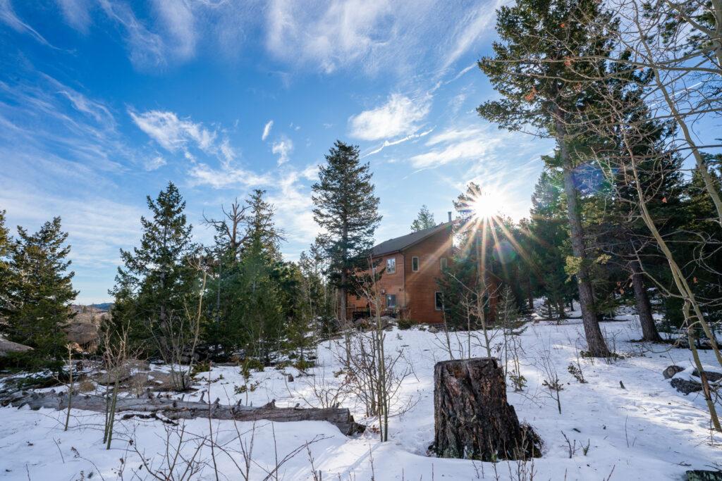 The sun rises over Darrin Harris Frisby’s Nederland home