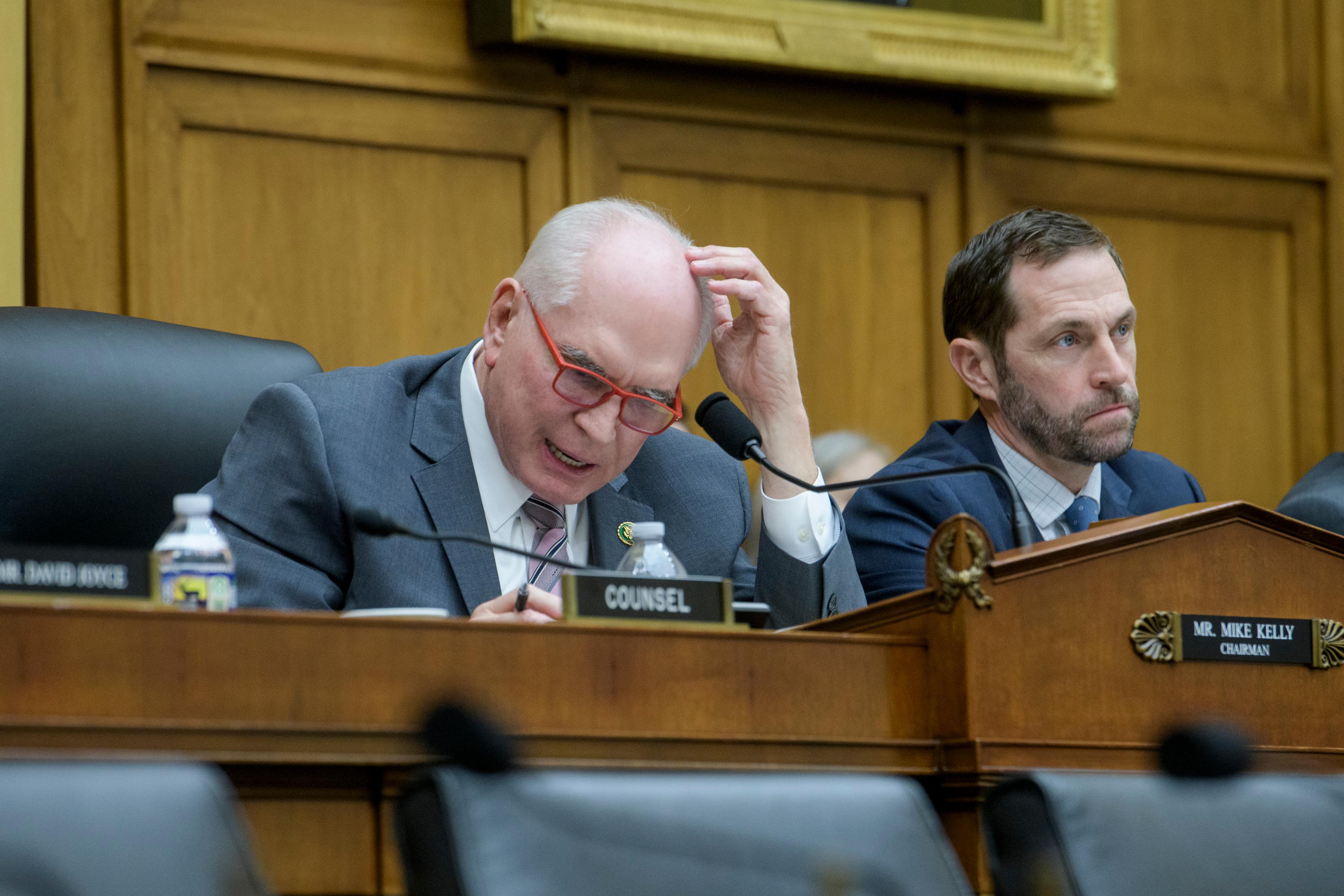 \Rep. Jason Crow, right, listens as Task Force chairman Rep. Mike Kelly, R-Pa.