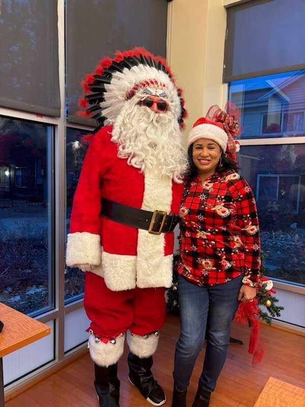 NDN Santa stands next to Colorado Matters host Chandra Thomas Whitfield