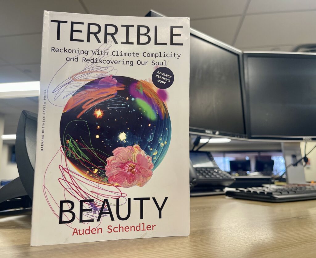 A copy of Terrible Beauty sits on a desk in the CPR newsroom