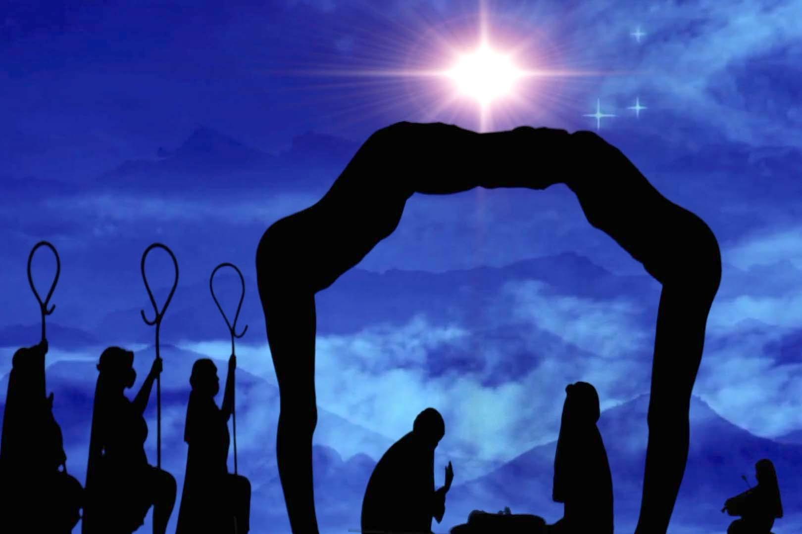 Dancers with the Silhouettes use their bodies to create a tableau of the shepherd's visiting Mary and Joseph in the manger, against a backdrop of the Christmas Star, as part of their "Light of Christmas" production.