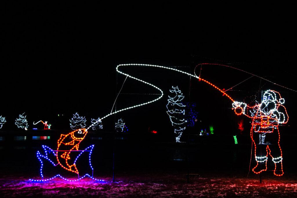 Holiday lights depict a flayfishing Santa Claus at the NoCo Winter Wonderland