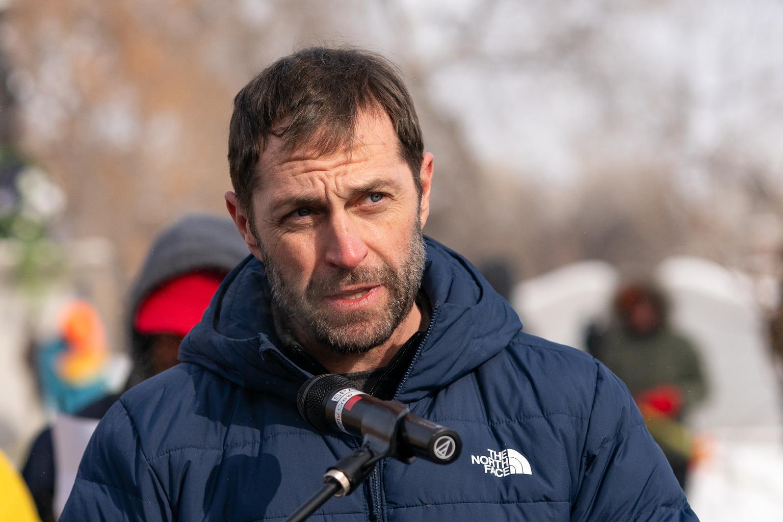 Congressman Jason Crow speaks to the crowd on Martin Luther King Day