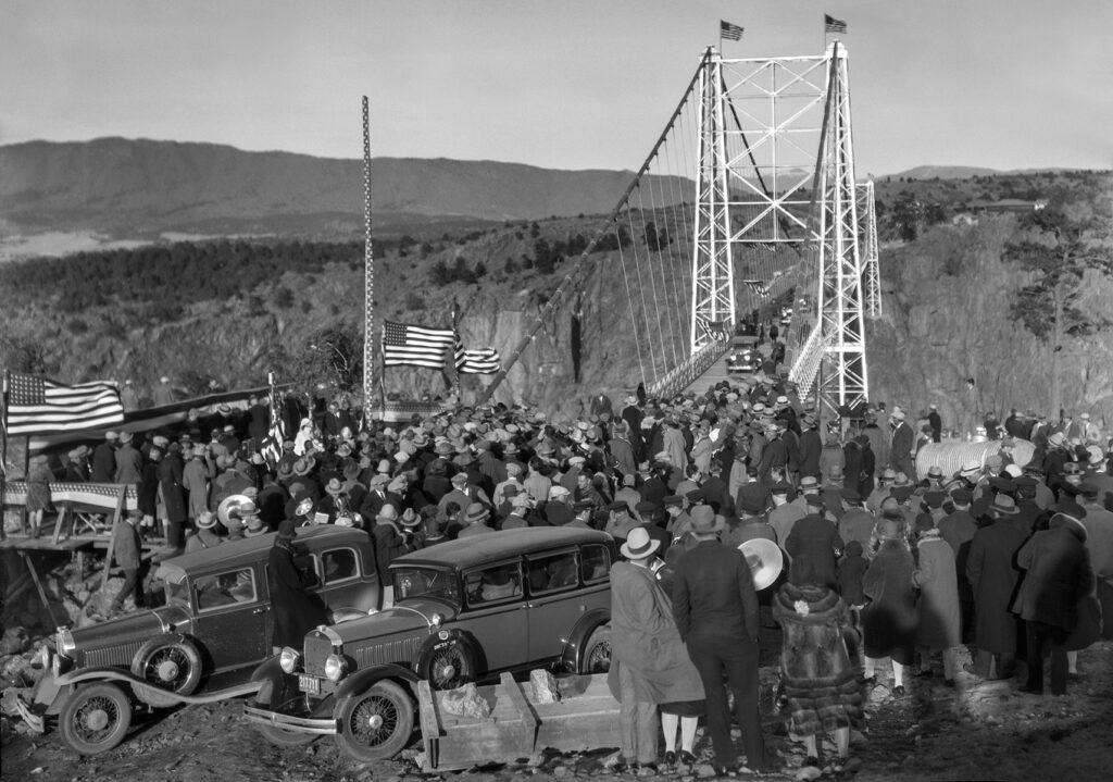 black and white image of a crowd at the bridge