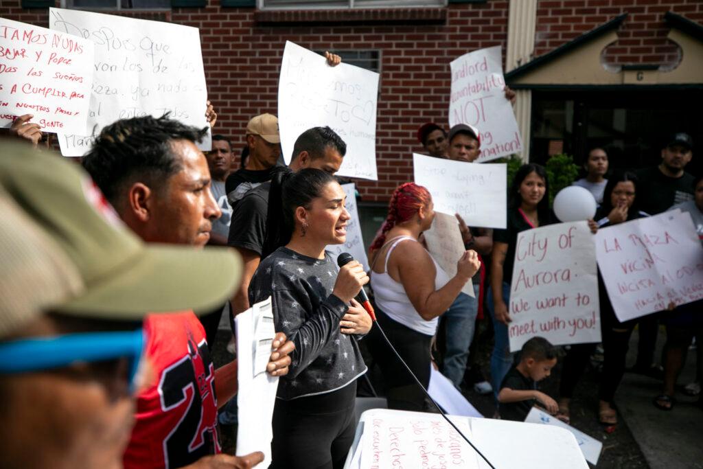 Residents of Aurora's Edge at Lowry apartment complex during a press conference