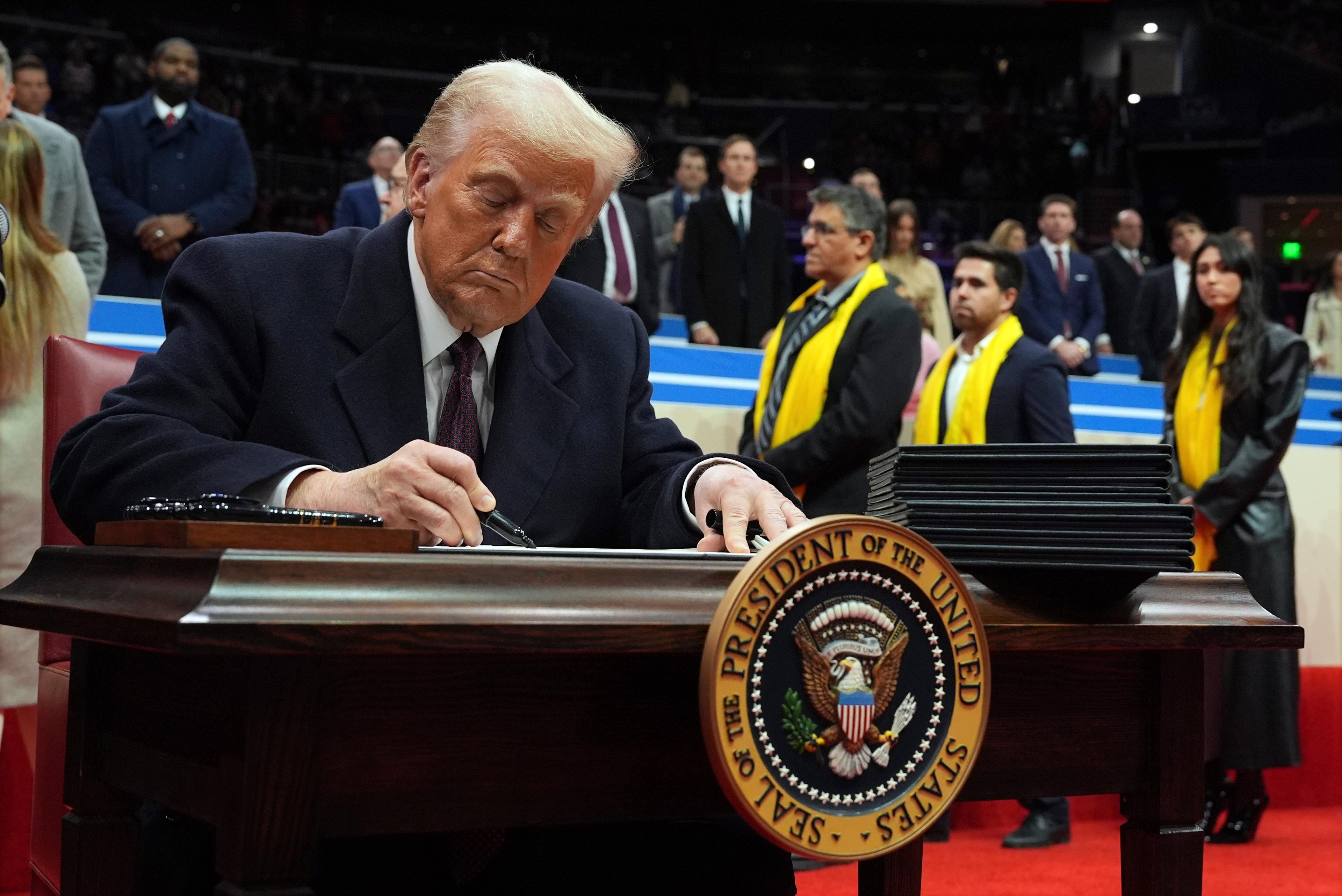 Donald Trump signs an executive order