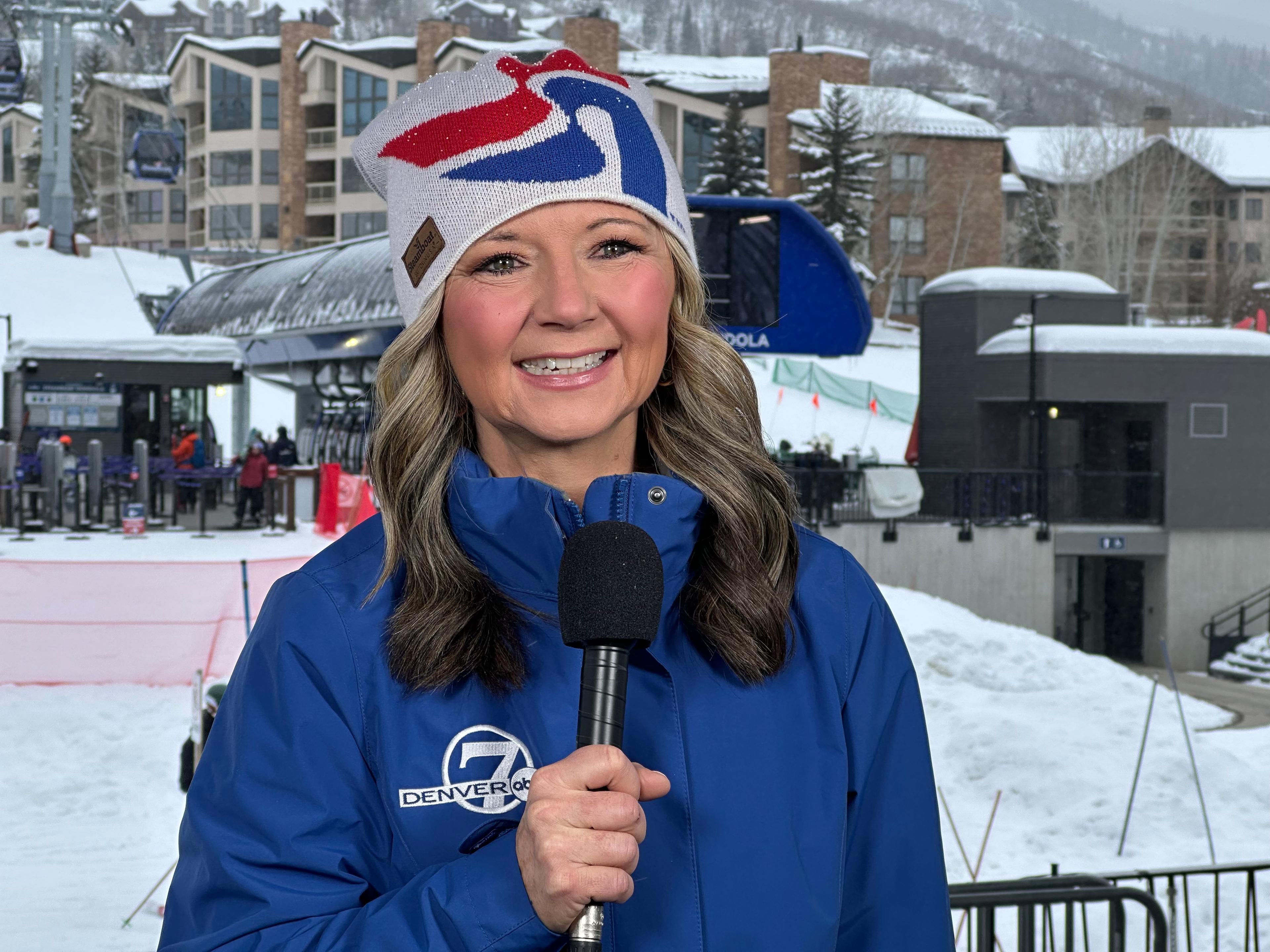 Denver7 chief meteorologist Lisa Hidalgo is holding a microphone outside at a weather conference in Steamboat Springs, Jan. 24, 2025.