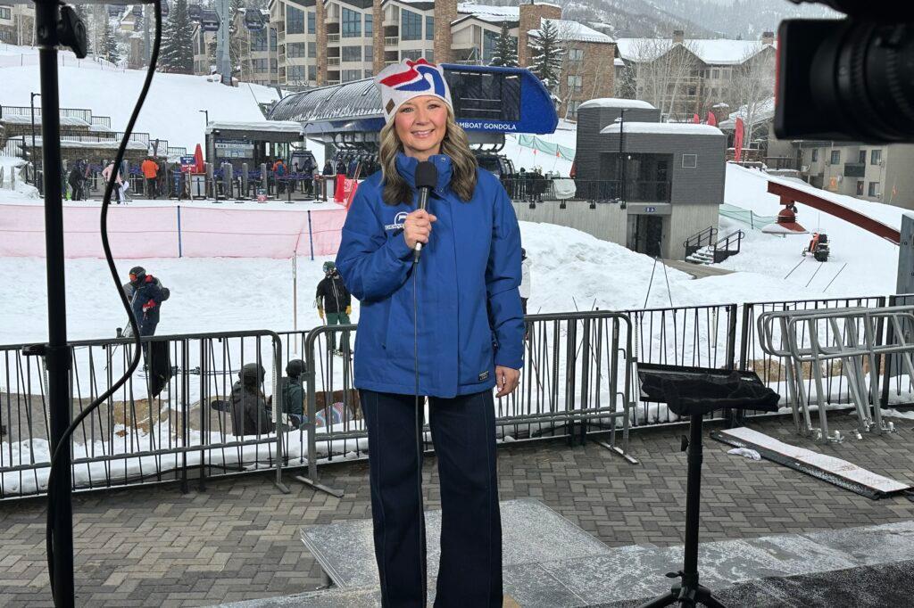 Denver7 chief meteorologist Lisa Hidalgo is holding a microphone outside at a weather conference in Steamboat Springs, Jan. 24, 2025.