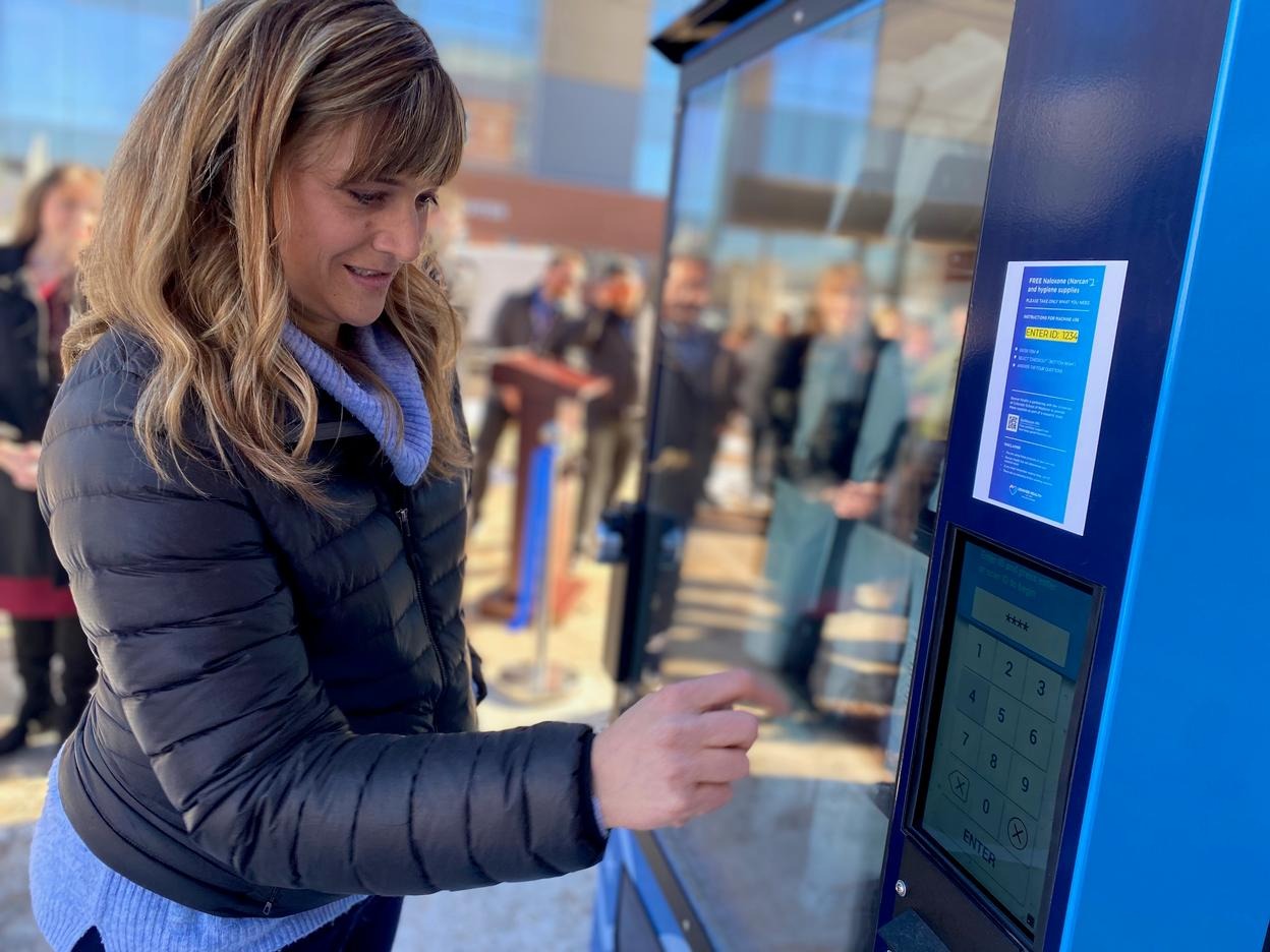 Nicole Wagner presses buttons on a touchscreen on a narcan vending machine at Denver Health on Jan. 27, 2025.