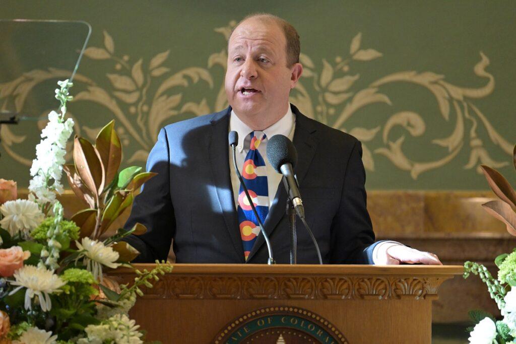 A man speaks at a podium