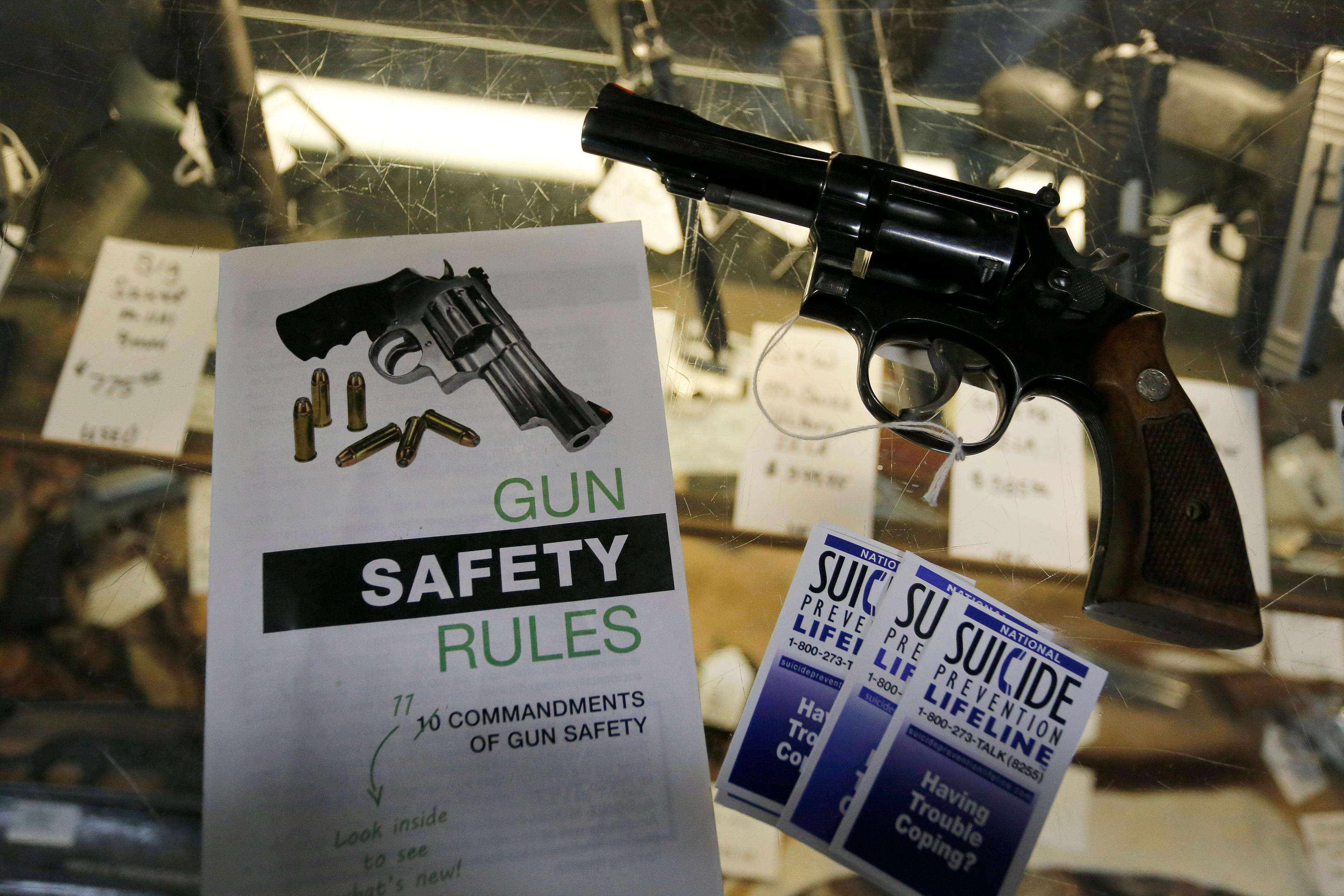 A gun on a glass table top