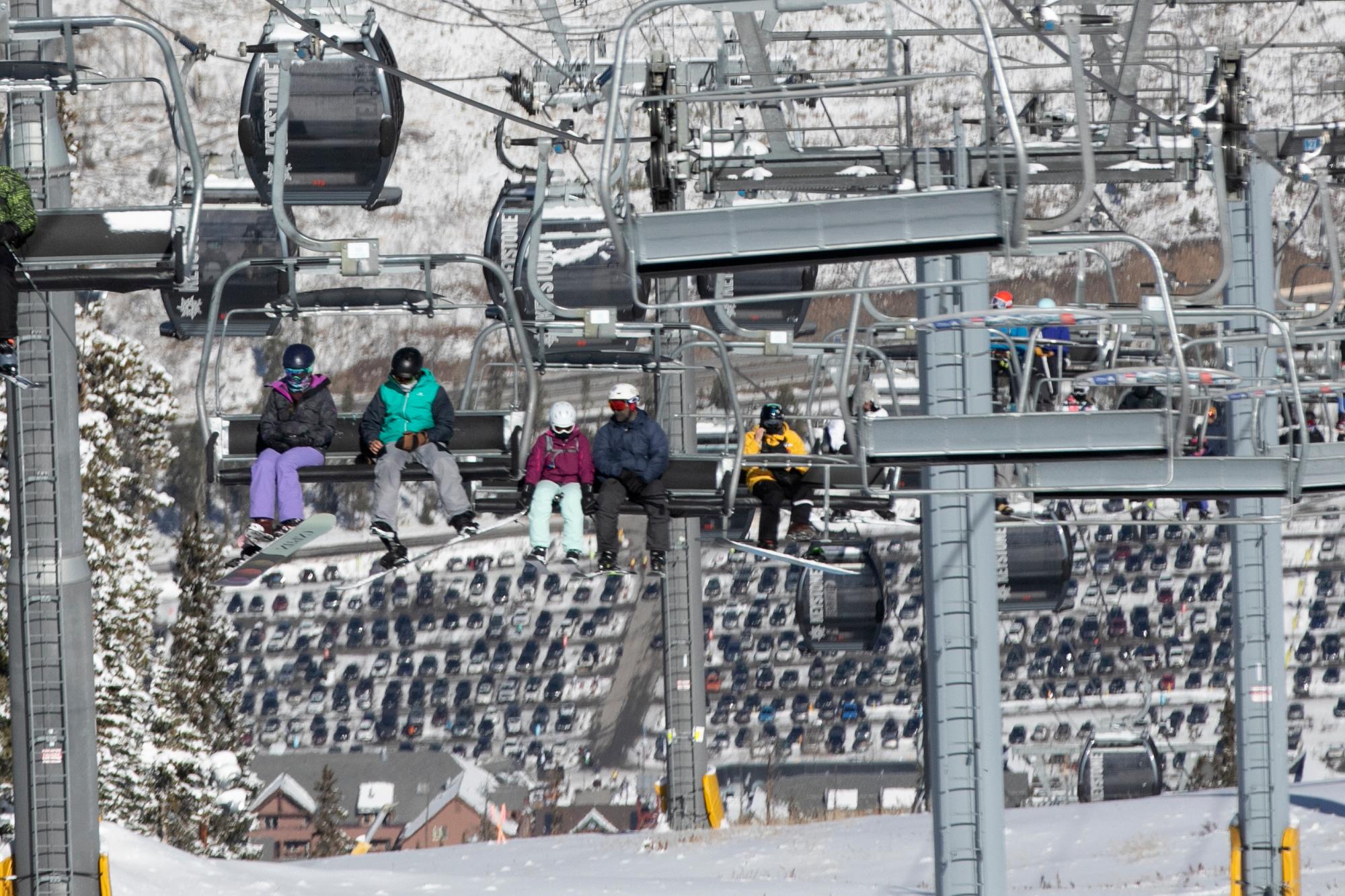 Skiers on a lift at Keystone Resort