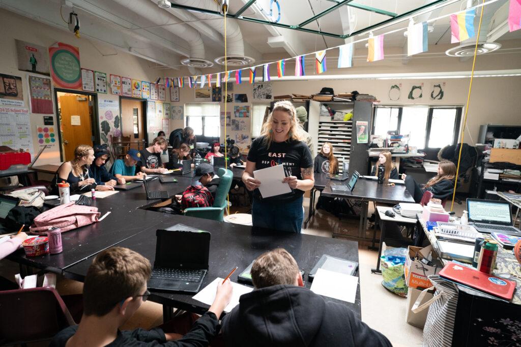 A teacher talks to students.