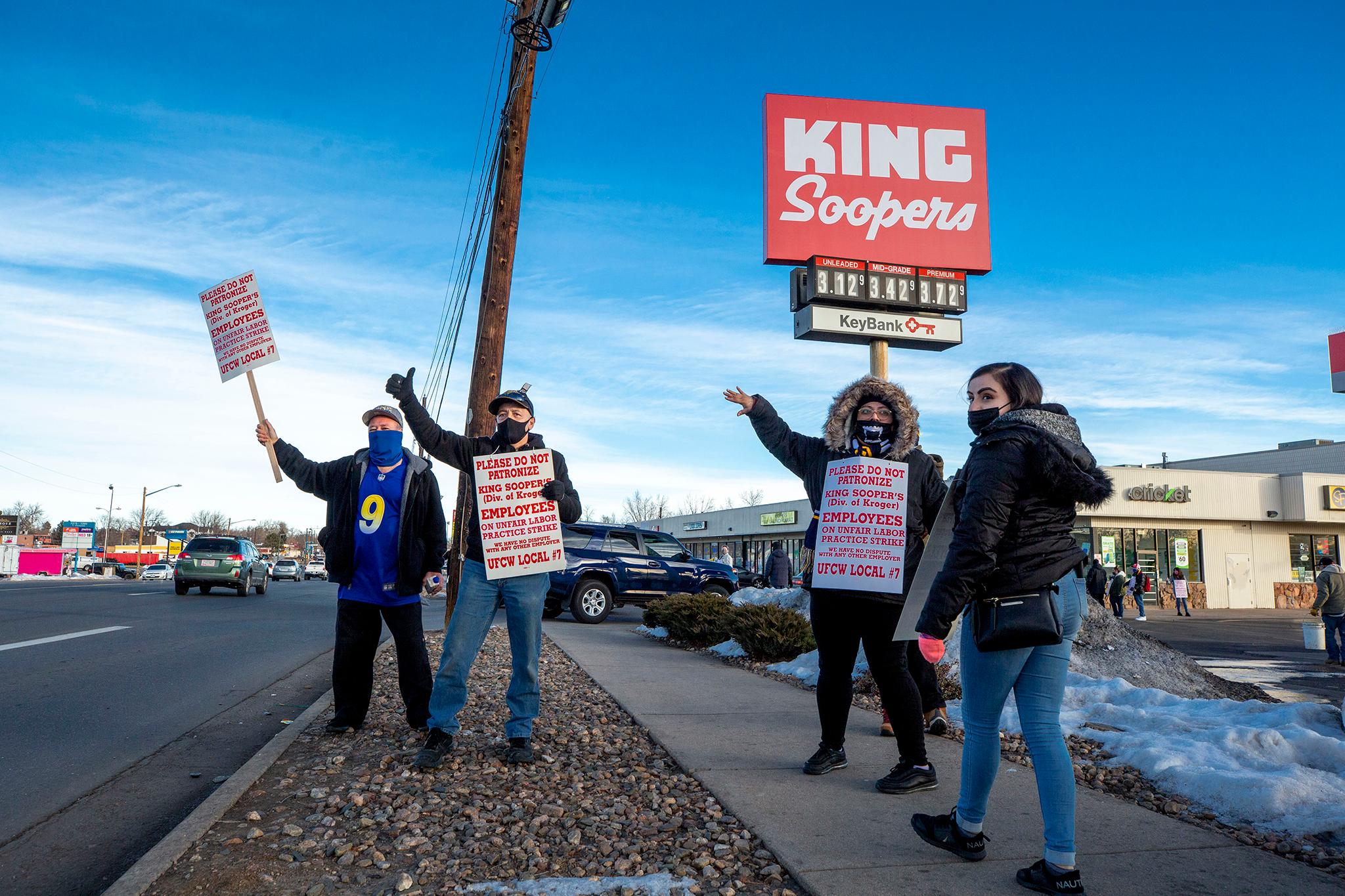 King Soopers employees hold signs on strike