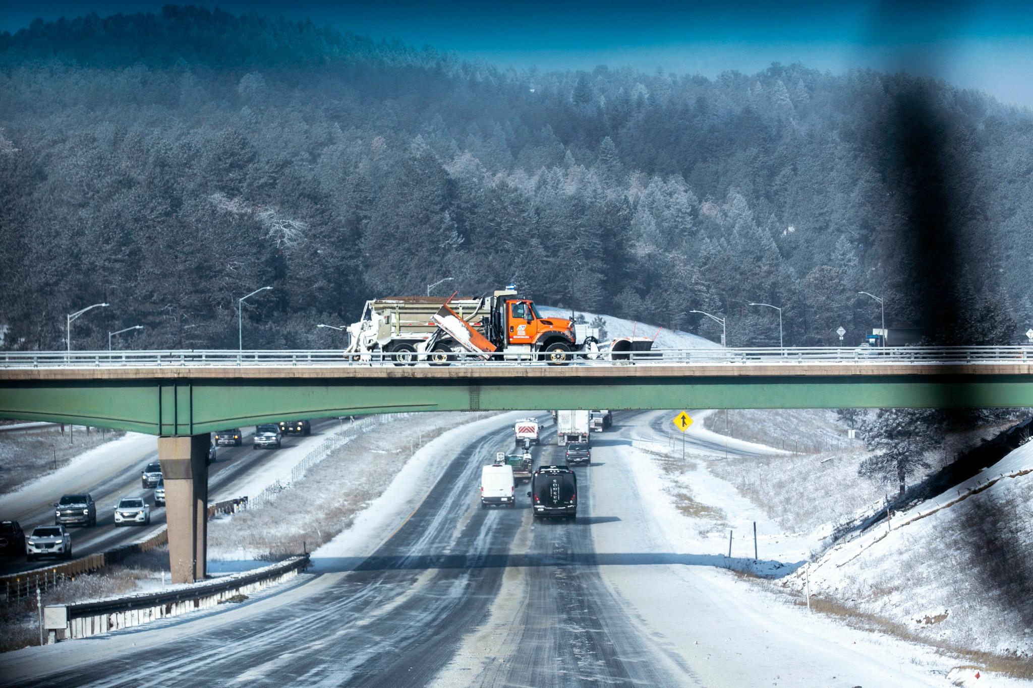 A CDOT snow plow drives over I-70 near Floyd Hill. Feb. 12, 2025.