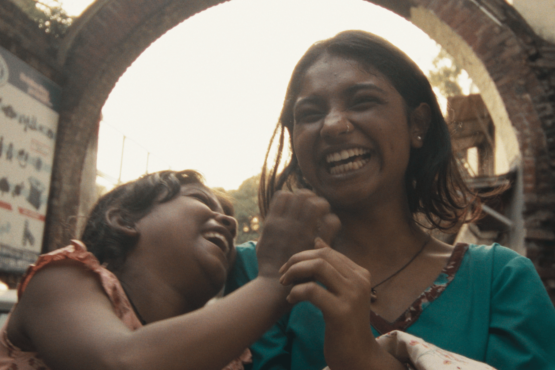 Two sisters on streets of New Delhi