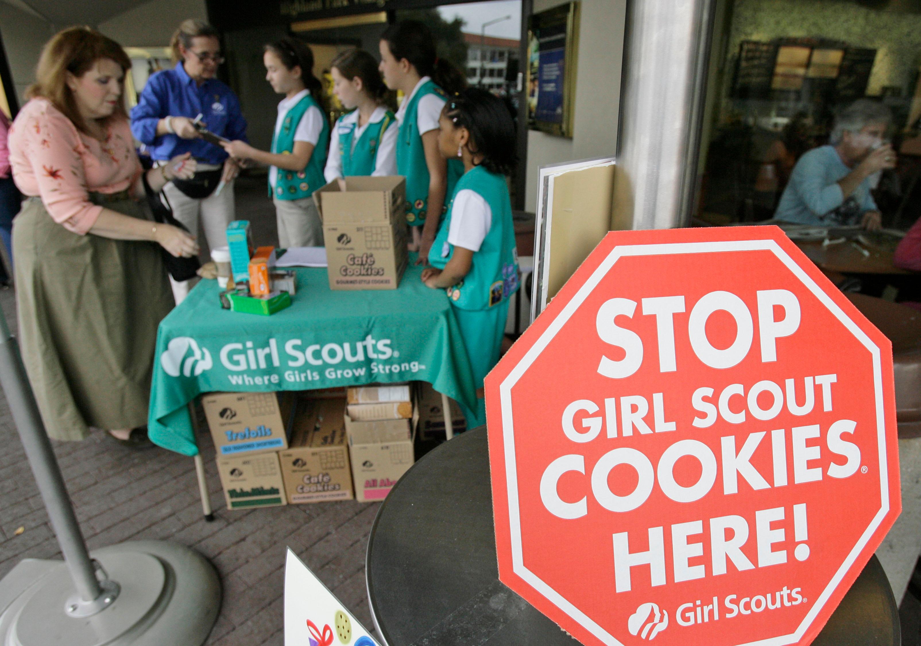 Girl Scouts selling cookies