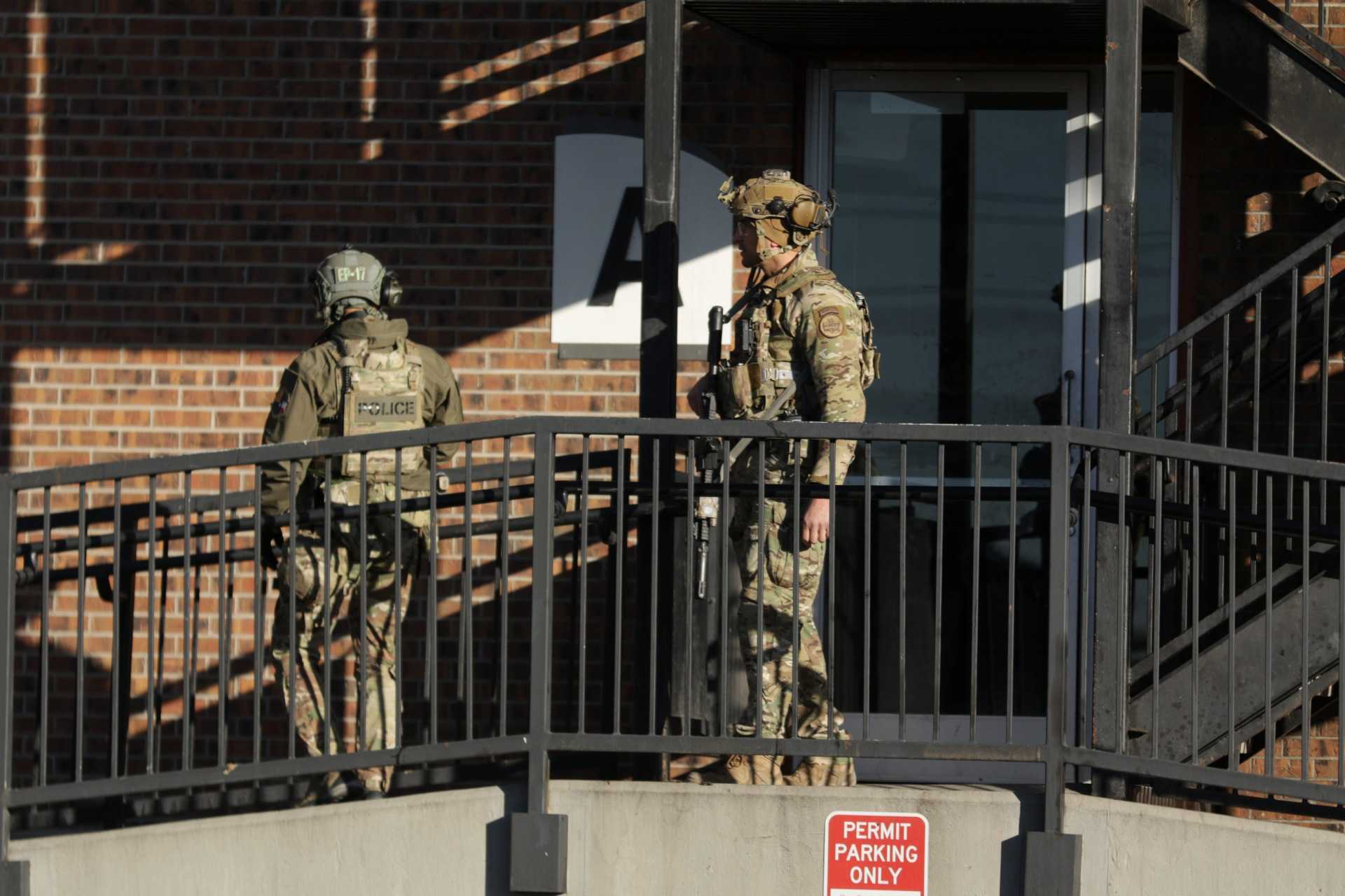 Federal law enforcement outside the Cedar Run Apartments