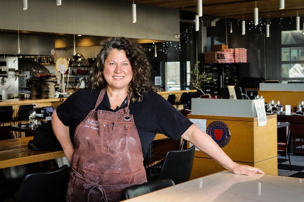 Chef Elise Wiggins stands proudly in the exhibition kitchen of her Cattivella Wood-Fired Italian restaurant.