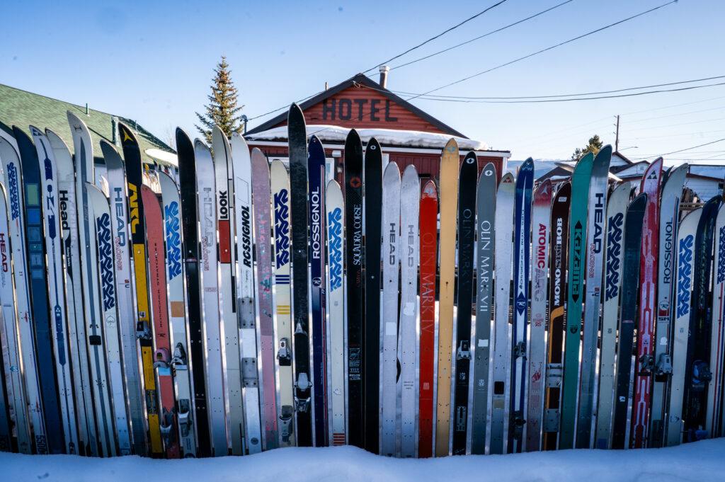 Old skis hammered together to form a fence