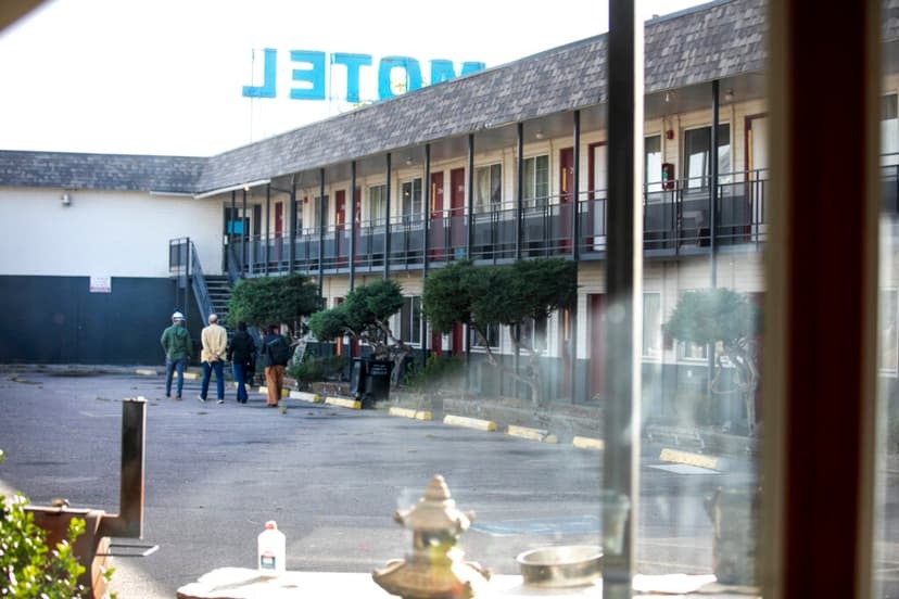 An inspection team, led by Sage Investments attorney Joshua Weiss, walks the Western Motor Inn property.