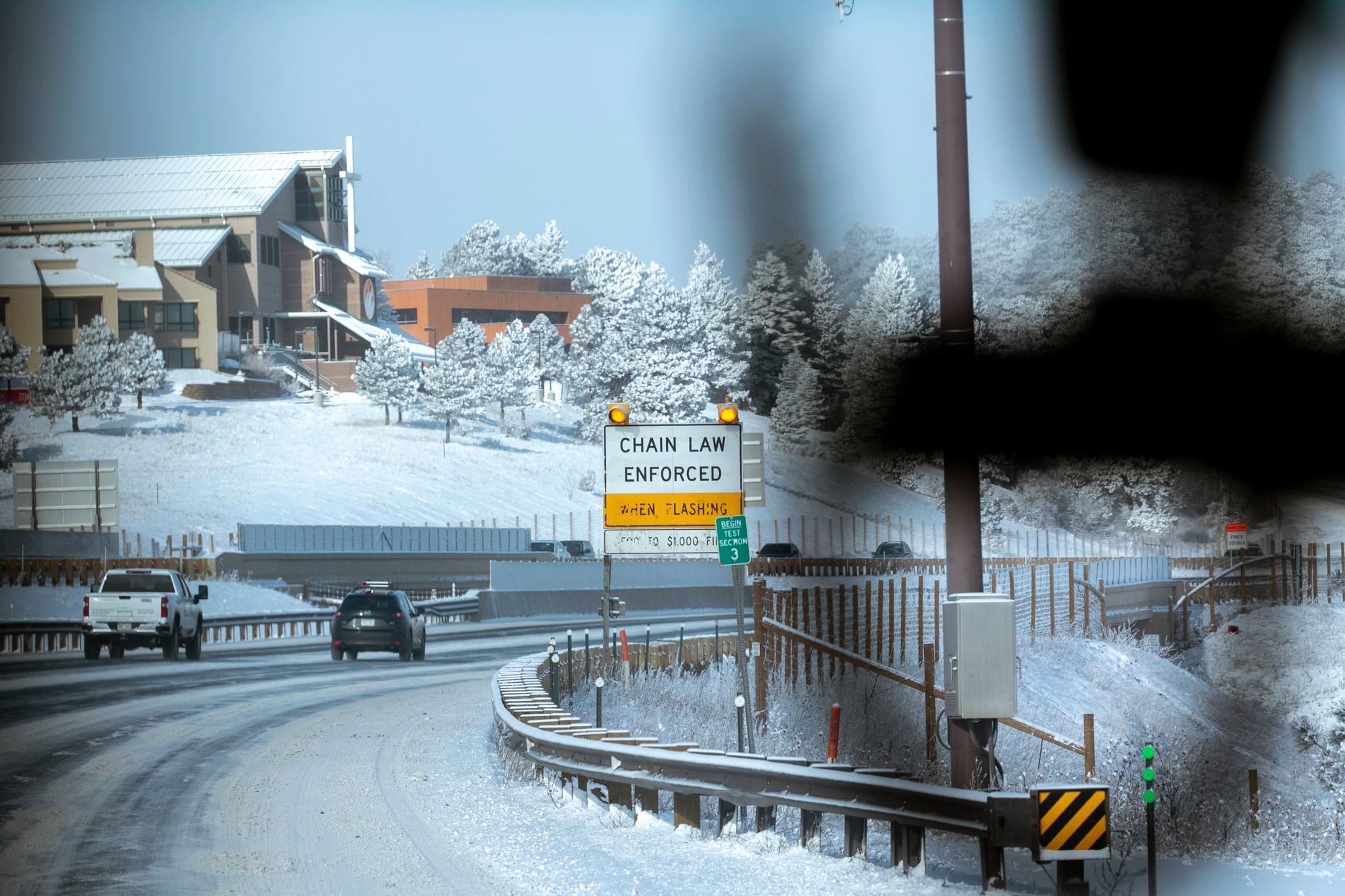 Cars and semi-trucks drive along I-70