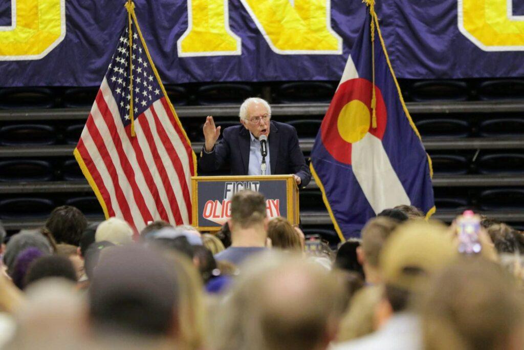 Bernie Sanders speaks from a podium that reads &quot;Fight Oligarchy&quot; at the Bank of Colorado Arena in Greeley