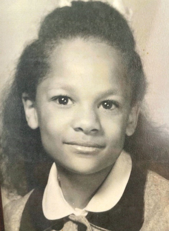 Black and white photo shows Wilma Webb as a first grader. The black and white photo is a close-up of her face.