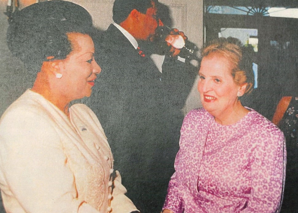 Wilma Webb is pictured looking at former Secretary of State Madeleine Albright in an undated newspaper photo.